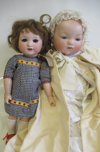 Two Armand Marseille bisque socket head dolls Image