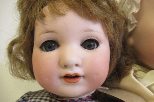 Two Armand Marseille bisque socket head dolls Image