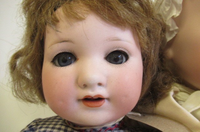 Two Armand Marseille bisque socket head dolls Image