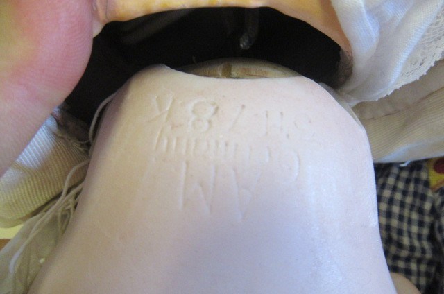 Two Armand Marseille bisque socket head dolls Image