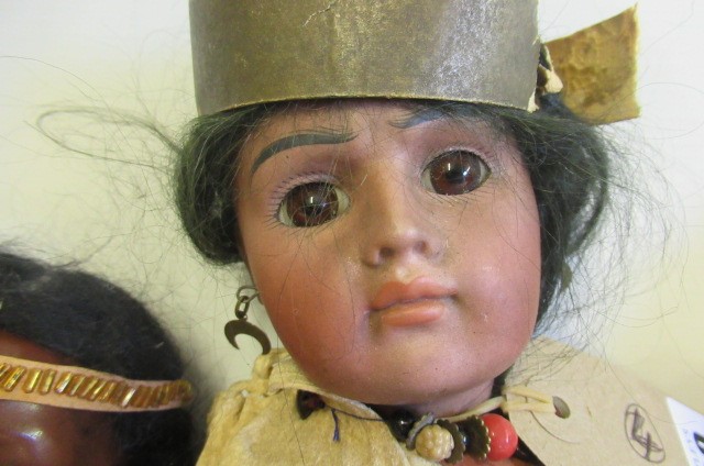 Two Native American themed bisque socket head dolls Image