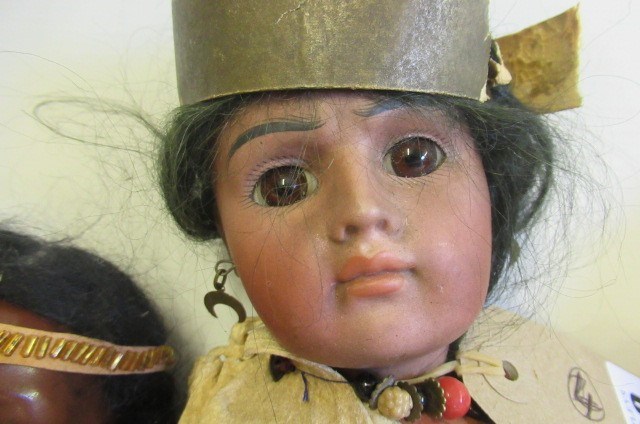 Two Native American themed bisque socket head dolls Image