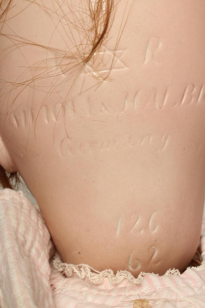 A Kammer & Reinhardt bisque socket head flirty doll Image