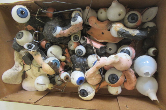 A box of spare glass dolls eyes Image