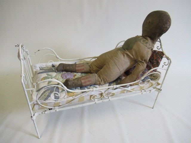 Two dolls beds and a raised crib Image