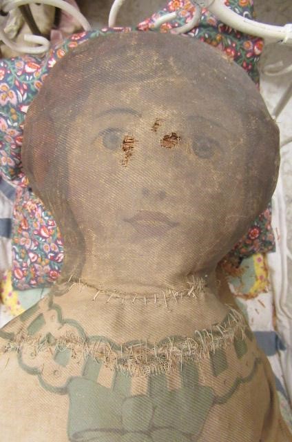 Two dolls beds and a raised crib Image