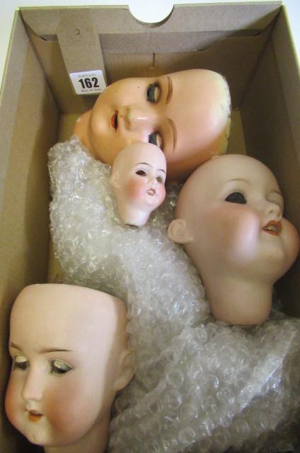 Four doll socket heads Image