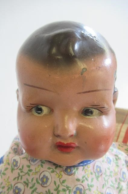 A painted metal dolls pushchair Image