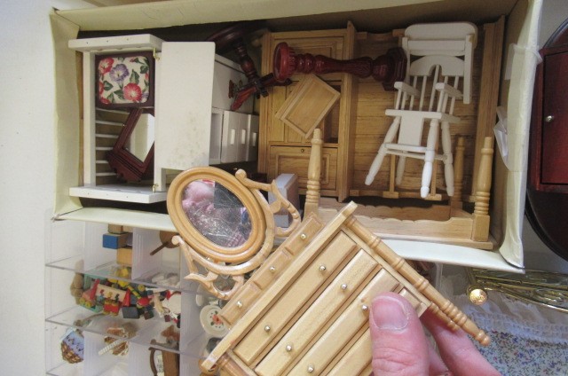 A large quantity of dolls house furniture and equipment Image