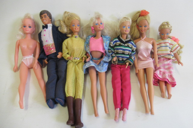 Five Barbie dolls and a Ken Image