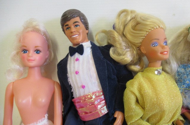 Five Barbie dolls and a Ken Image