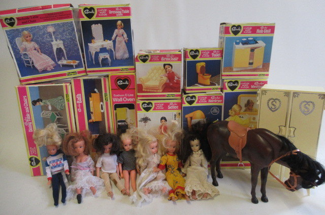 Seven Sindy dolls and a large quantity of clothing and equipment Image