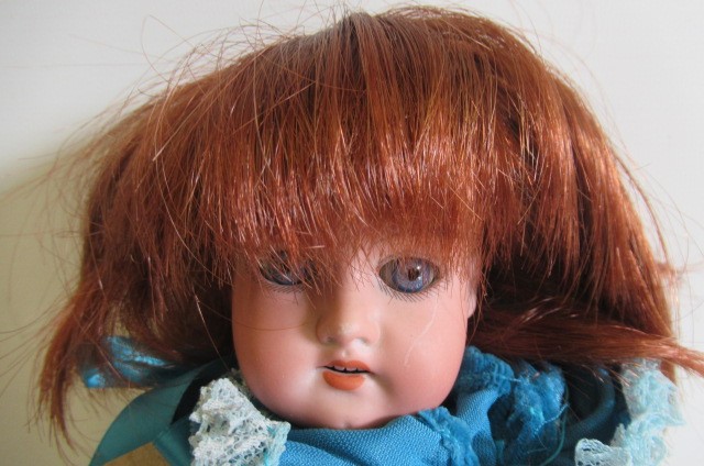 An Armand Marseille bisque shoulder head doll Image