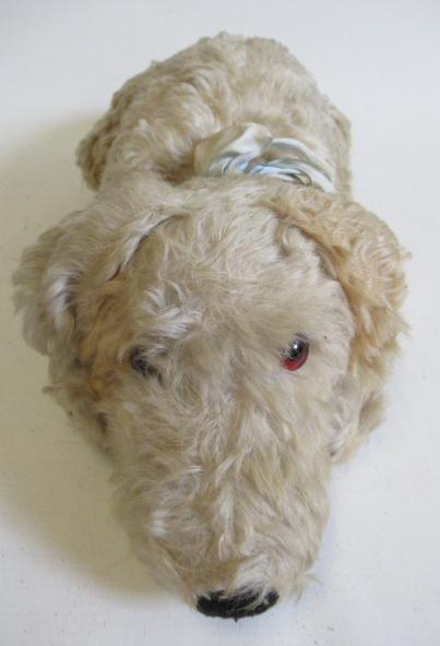 A Merrythought lying dog Image