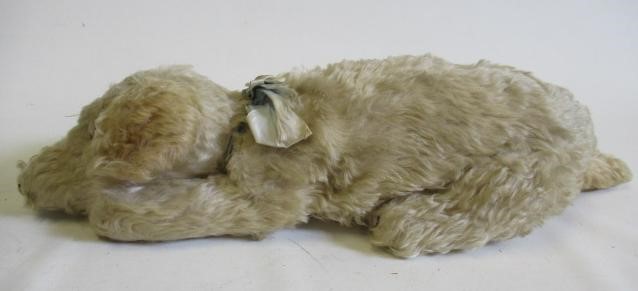 A Merrythought lying dog Image