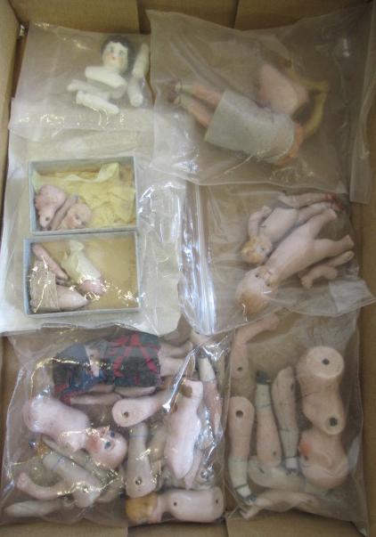 A collection of dolls house dolls and parts Image