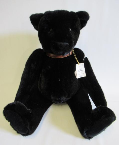 A large "OUT-O-THE WOODS" growling teddy bear Image