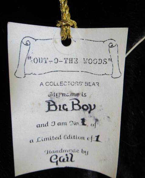 A large "OUT-O-THE WOODS" growling teddy bear Image