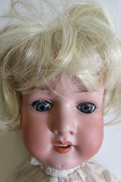 Three bisque socket head character dolls Image