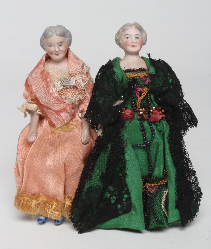 A pair of old lady bisque shoulder head dolls house dolls Image