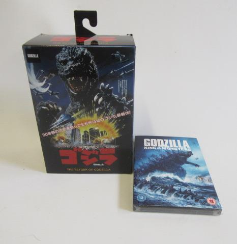 Return of Godzilla figure by Toho and DVD of Godzilla film Image