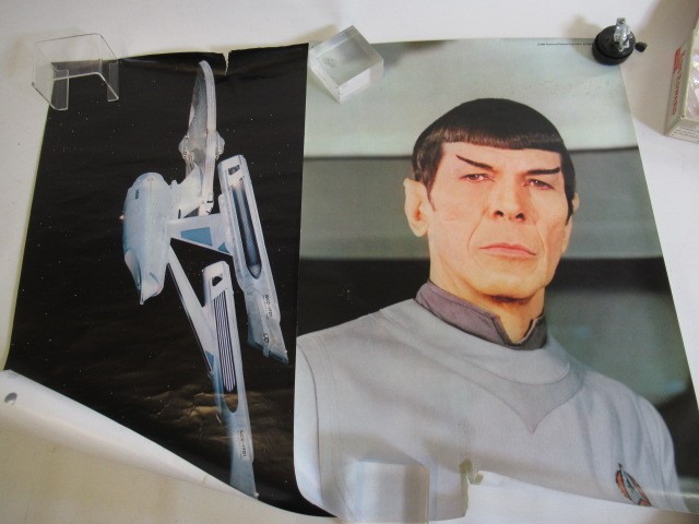 Three Star Treck posters and a "War for the Planet of the Apes" film poster Image