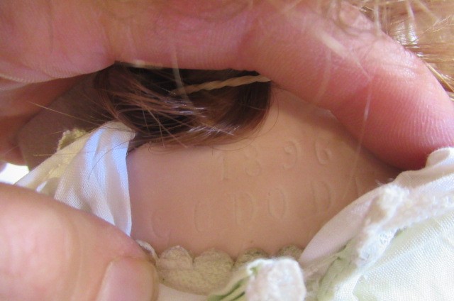 A Cuno & Otto Dressel bisque shoulder head doll Image