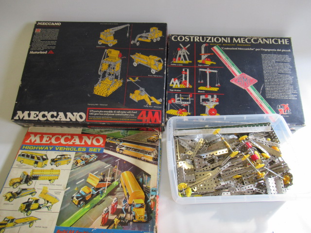 Three modern issue Meccano sets and a large quantity of Silver Strip Meccano pieces Image