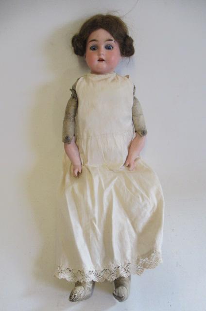 An Armand Marseille bisque shoulder head doll Image