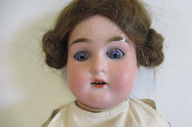 An Armand Marseille bisque shoulder head doll Image
