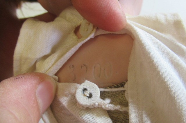 An Armand Marseille bisque shoulder head doll Image