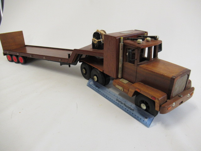 A wooden American type truck and trailer finished in varnished wood Image