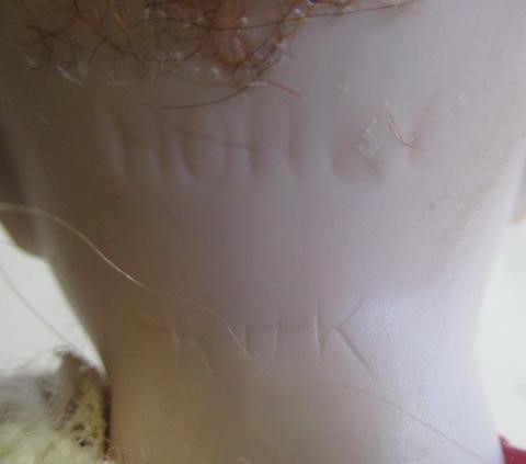 Two bisque socket head dolls comprising a 7 1/2" doll with blue glass sleeping eyes Image