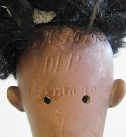 A Simon & Halbig mulatto girl bisque socket head doll Image