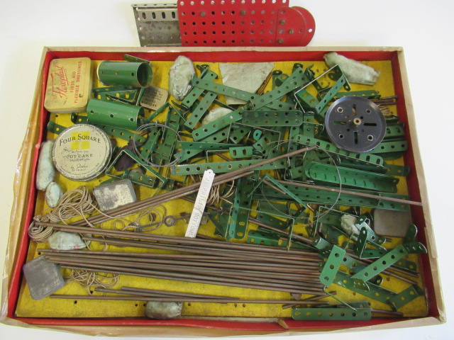 Meccano used red and green strips and rods Image