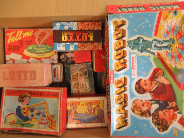 A quantity of board games and small character toys Image