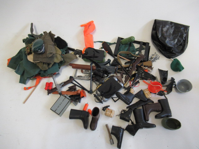 A quantity of Action figure accessories including guns Image