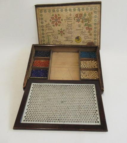 A 19th century Konemanns mosaic board with eight different coloured balls Image
