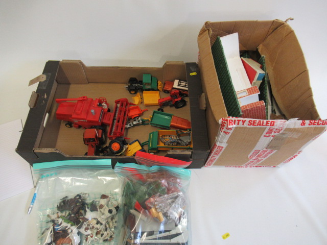 A wooden farm building with Britains modern issue farming equipment Image