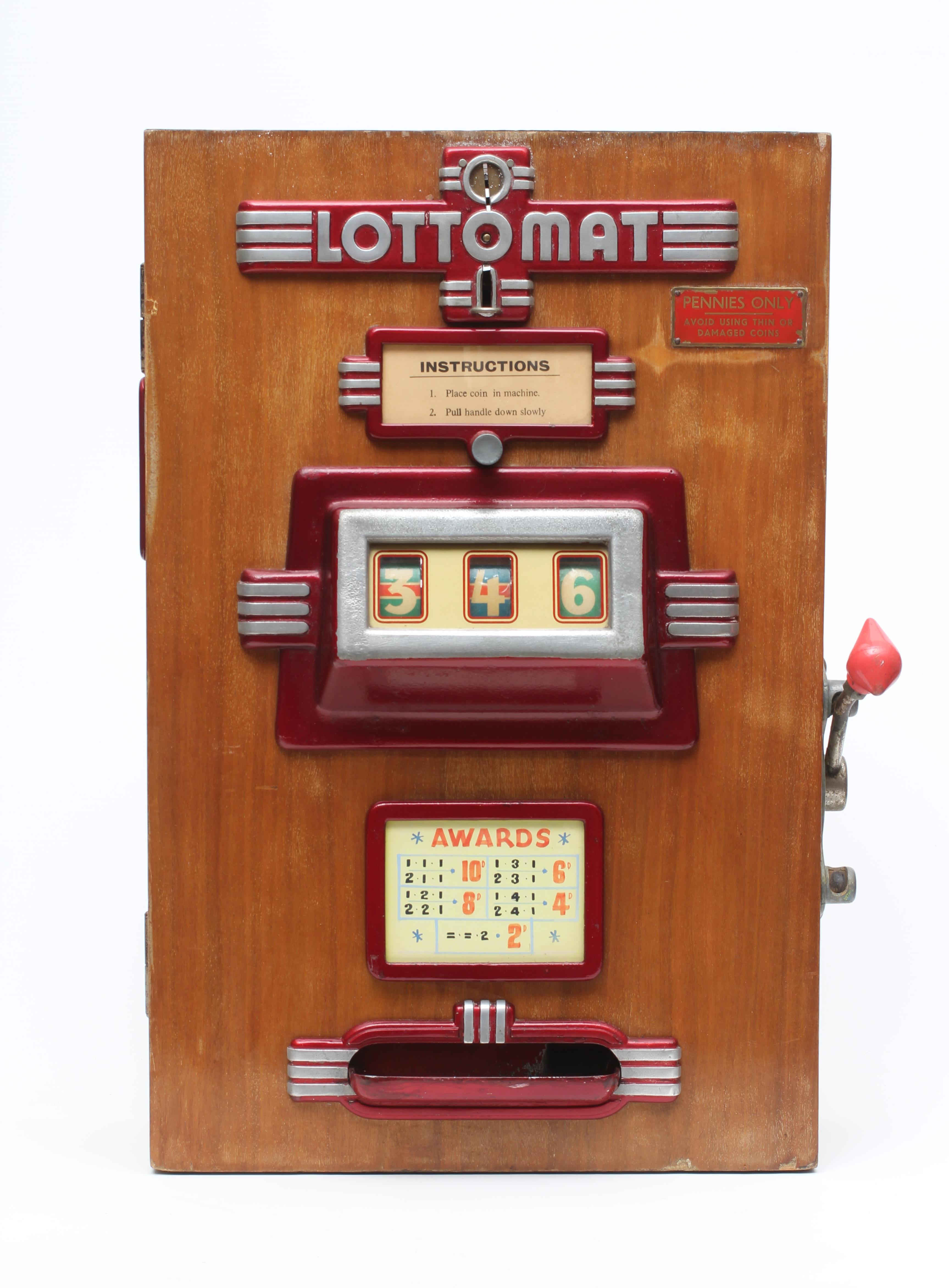 A Lottomat "one armed bandit" slot machine of wooden construction Image
