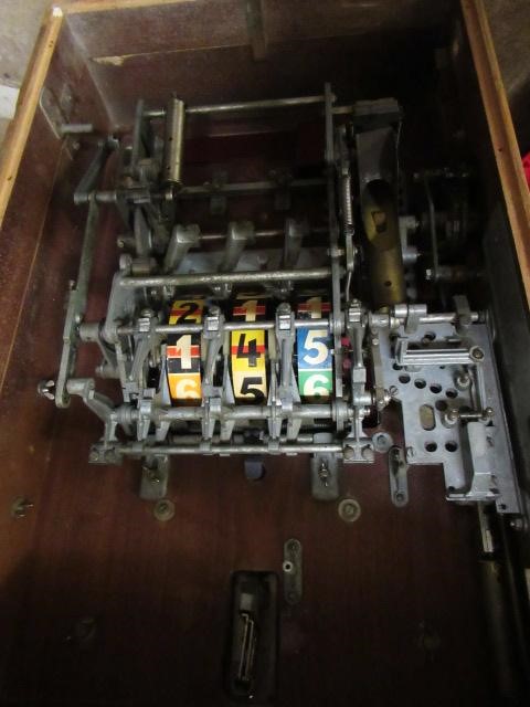 A Lottomat "one armed bandit" slot machine of wooden construction Image