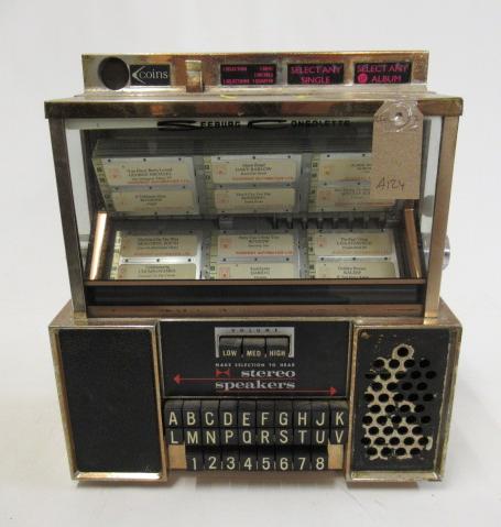 A Seeburg Consolette wall mounted juke box Image