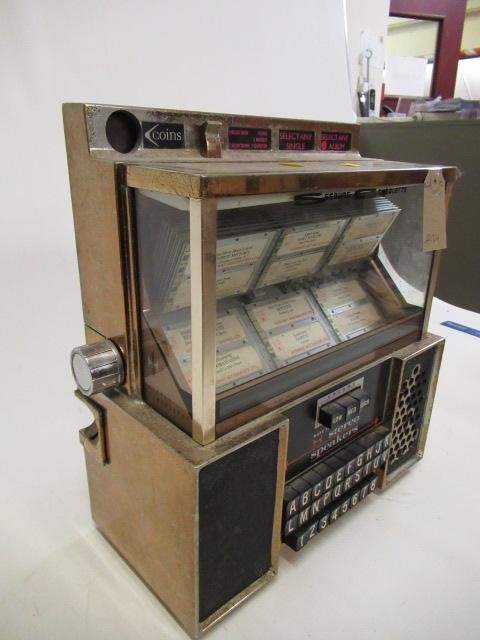 A Seeburg Consolette wall mounted juke box Image