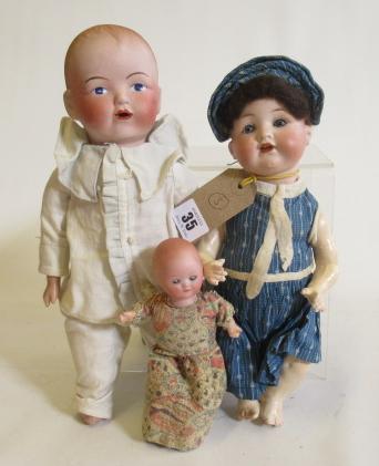 Three bisque head dolls Image