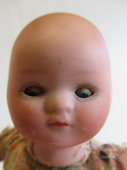 Three bisque head dolls Image