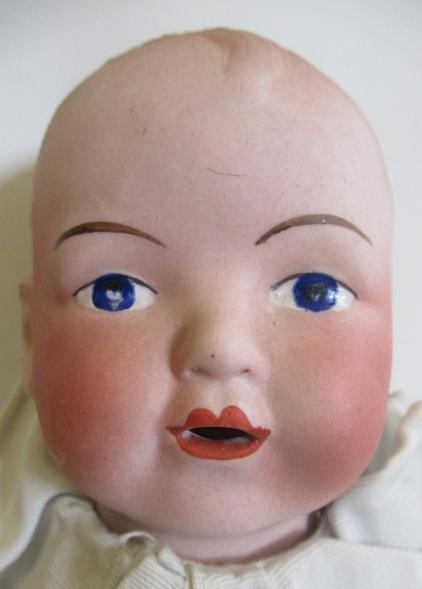Three bisque head dolls Image
