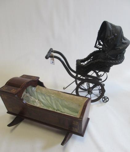 A Victorian style dolls pushchair Image