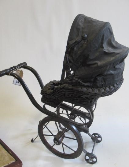 A Victorian style dolls pushchair Image