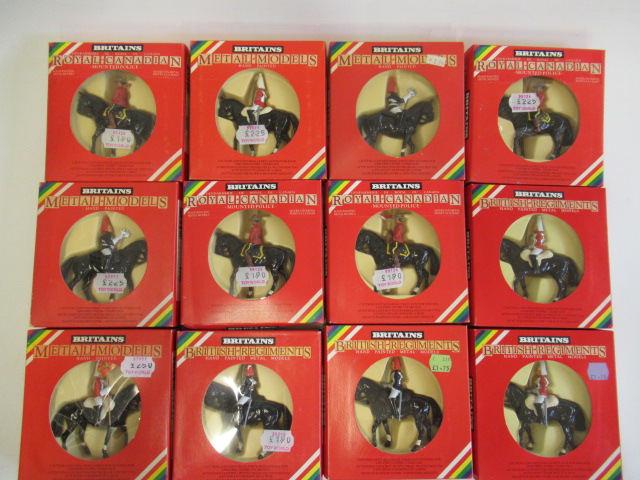 Twelve Britains figures on horseback including Lifeguards and Mounted Police Image