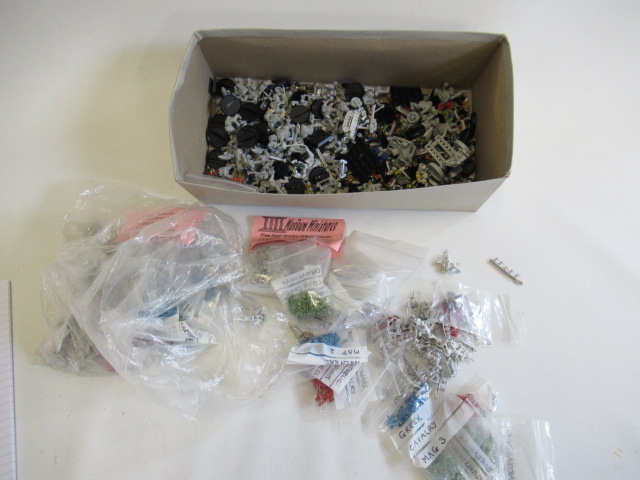 War games and D and D figures of different scales and armies Image